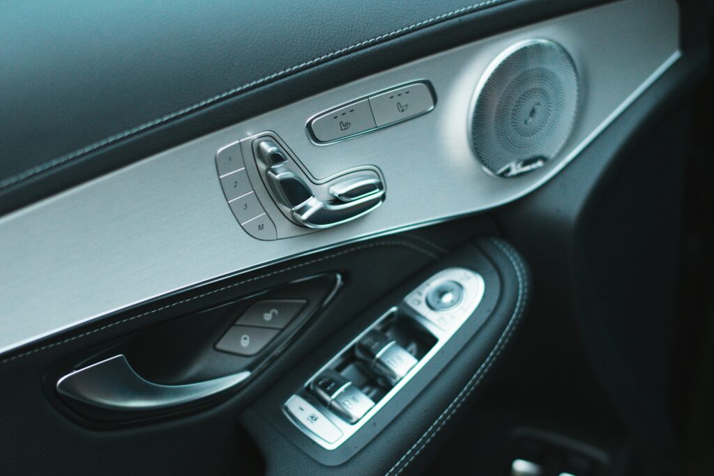 close up auto door panel controls