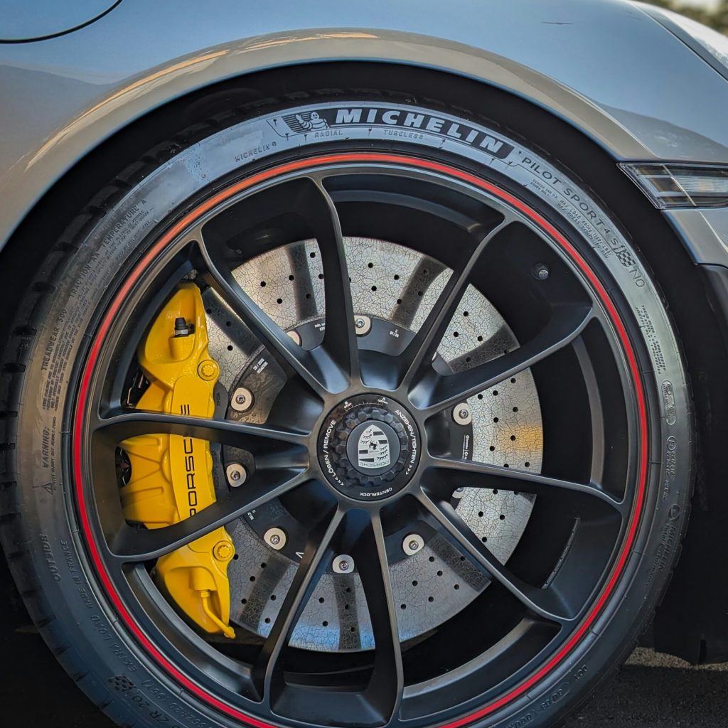 Michelin Tire on Porsche coupe showing Wide range of tires from street to fleet applications — reliable tire services and replacements at Alpha Transmission Houston for all vehicle types